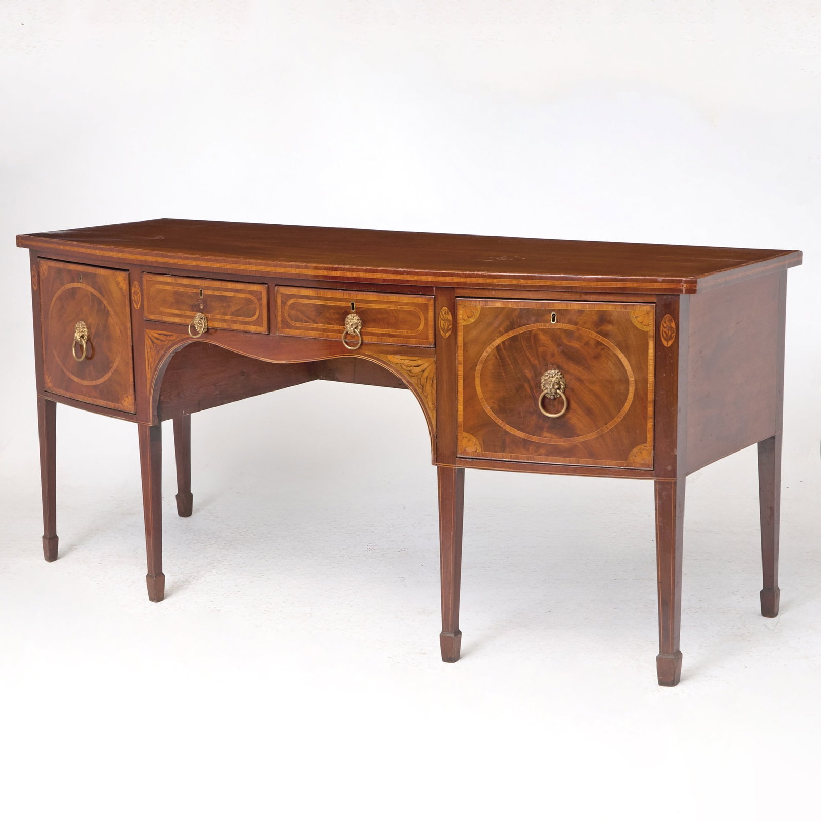 George III Inlaid Mahogany Sideboard: Height 35 1/4 inches, width 6 feet 6 inches, depth 30 1/2 inches. cracking to top and veneer; staining to top; losses to veneer; old marks and scratches; brasses replaced