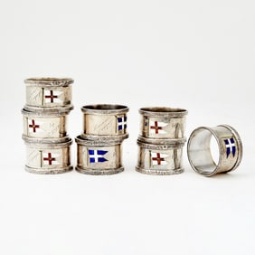 Assembled Set of Eight George V Sterling Silver and Enamel Novelty Napkin Holders