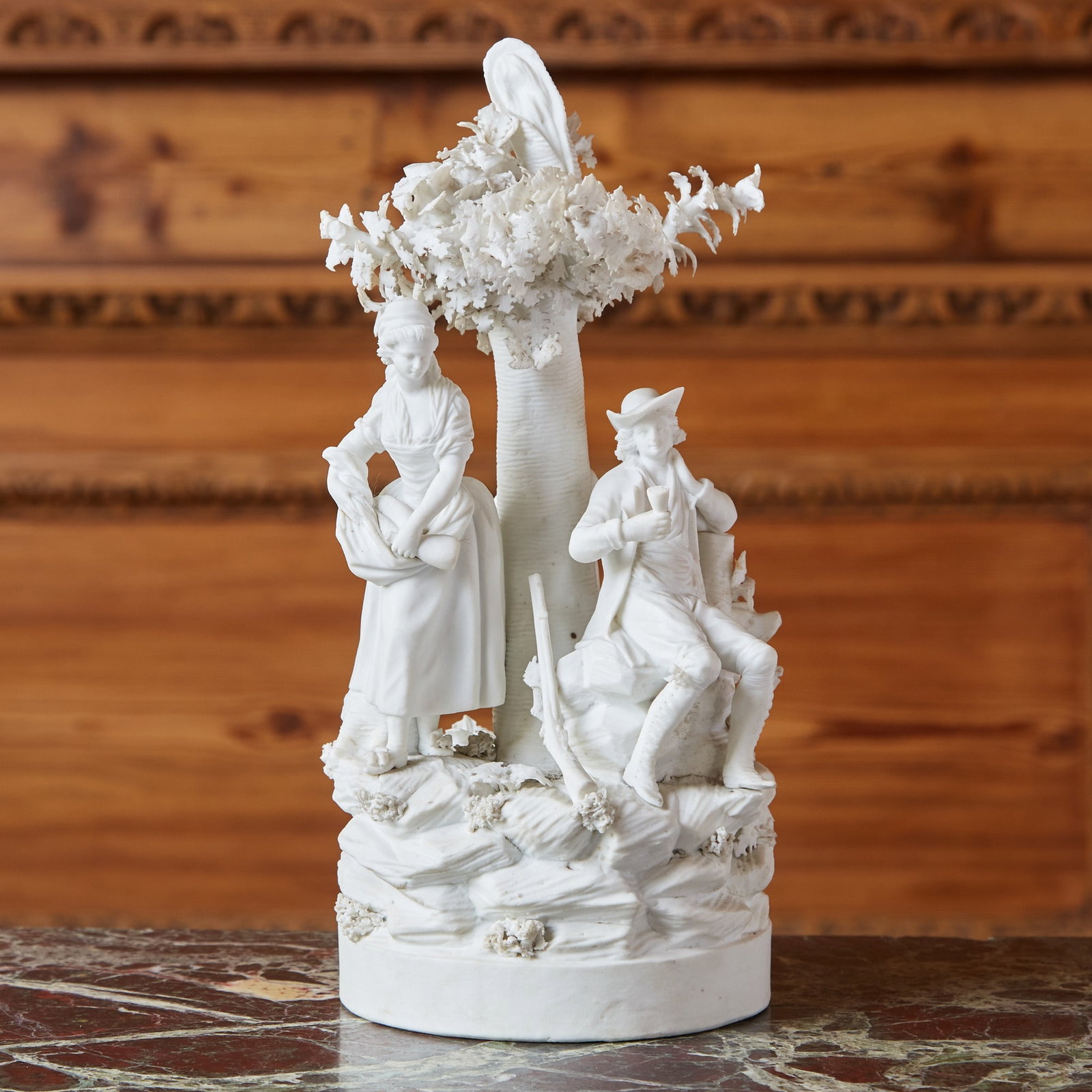 Paris (Locre) Biscuit Porcelain Figure Group of a Hunter and Companions: Estate / Collection: The Dalva Brothers Collection Circa 1790 Depicted in the round with a seated hunter resting before a tree, his gun leaning against the rockwork and his hound at his side, attended