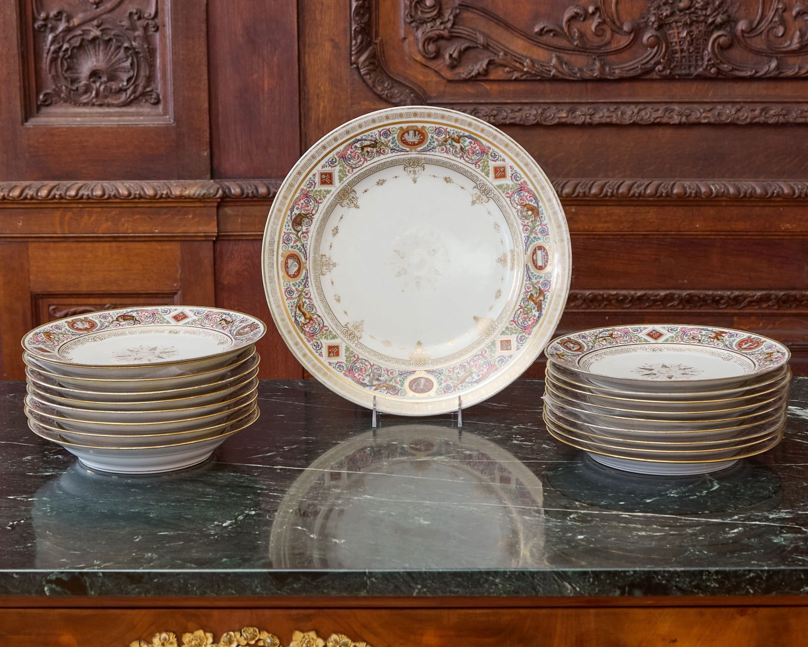 Set of Eighteen Sèvres-Style Porcelain Plates and a Large Charger: Estate / Collection: The Dalva Brothers Collection Late 19th Century After the original ‘Service de Chasse de Fontainebleau’ made for Louis Philippe, duc d'Orleans, each center with a gilt