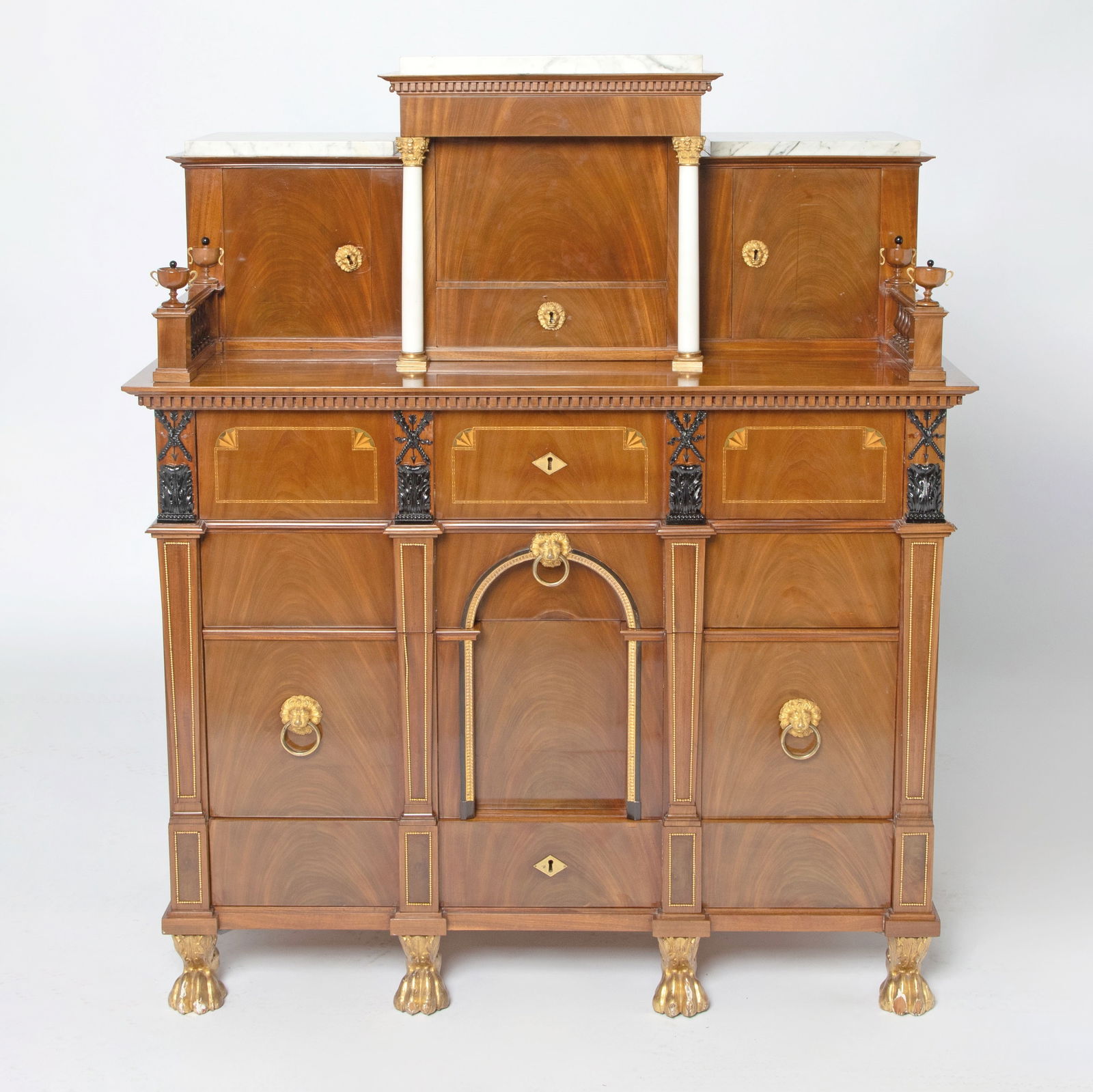 Swedish Karl Johan Gilt-Bronze and Marble Mounted Parcel Ebonized Mahogany Bureau-Cabinet: Circle of Lorentz Wilhelm Lundelius, Stockholm, Circa 1815-1820 Centered at the top by a cupboard fitted with a secret compartment flanked by white marble columns with gilt-bro