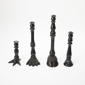 Set of Four Iris Apfel Black Animal Feet Candlesticks
