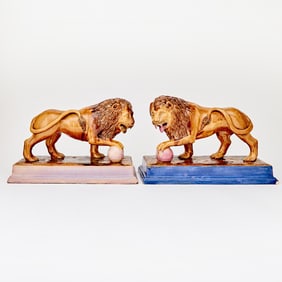 Pair of English Rockingham Style Glazed Pottery Figures of Lions