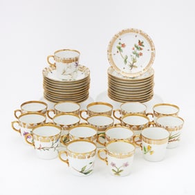 Group of Royal Copenhagen Flora Danica Style Floral Decorated Porcelain Demitasse Cups and Saucers