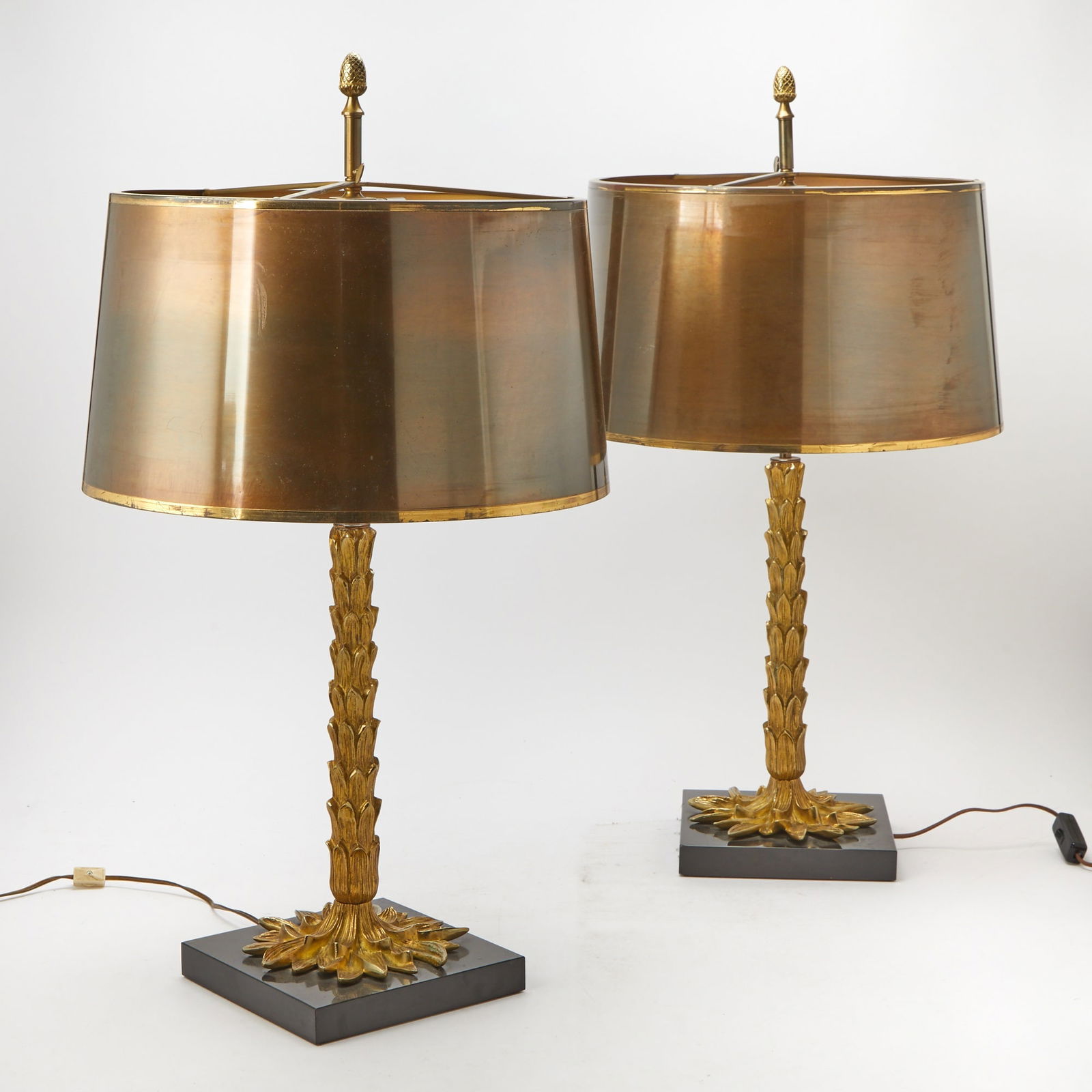Pair of Maison Charles Gilt-Metal "Palme" Table Lamps with Gilt-Metal Shades: Designed by Jean Charles for Maison Charles, Paris, second half 20th century Each of palm tree form, on a square polished black marble base, stamped on the ring mount CHARLES MADE IN FRANCE. Height ov