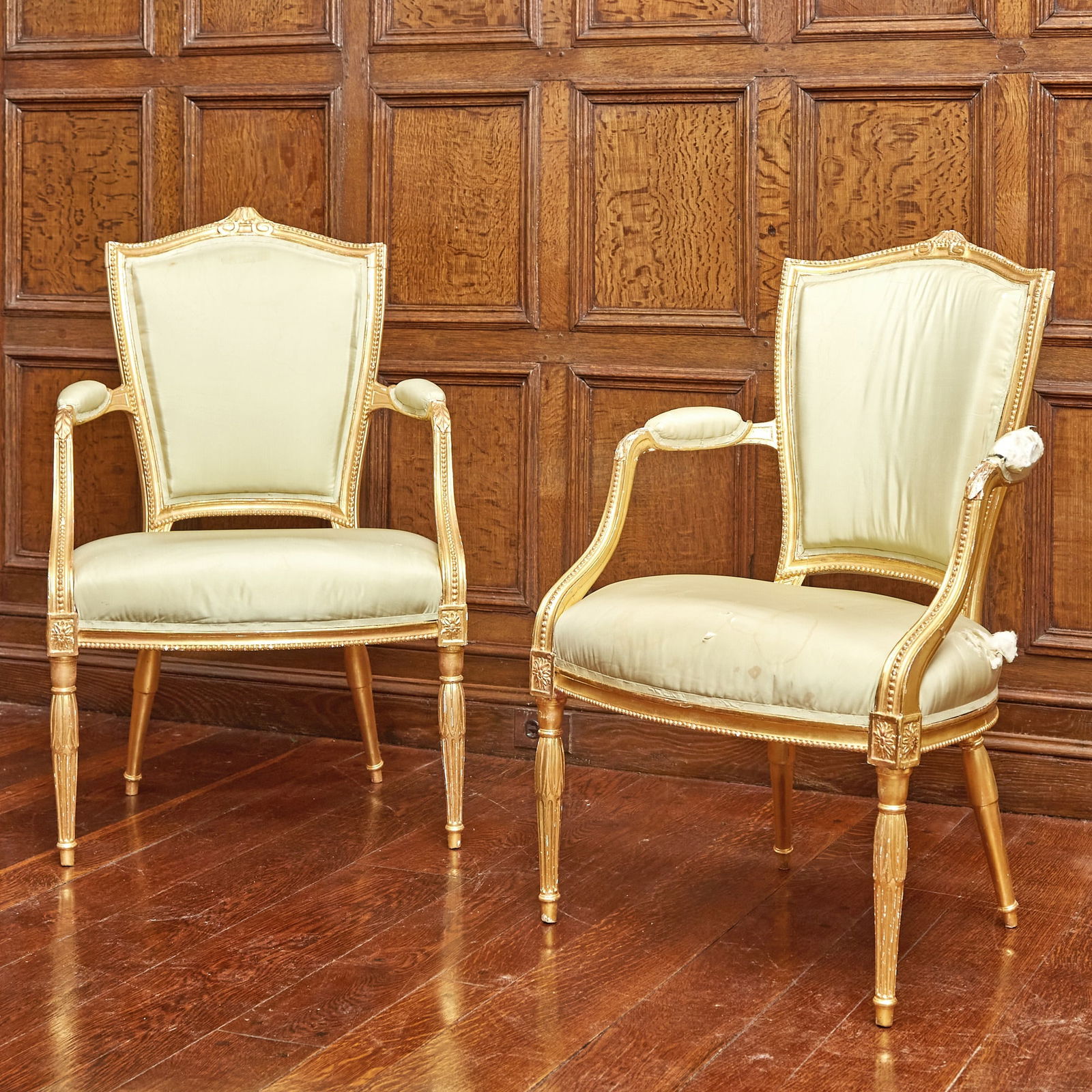 Pair of George III Giltwood Armchairs: 18th century, regilt. Height 36 1/2 inches, width 25 inches, depth 18 inches. Seat height 17 inches. Qty: (2) Torn fabric.