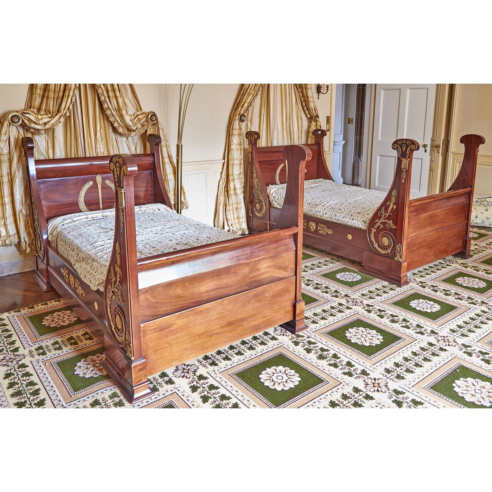Pair of Empire Style Gilt-Bronze Mahogany Daybeds: Estate / Collection: The Chimneys: The Estate of Allan Goldman Late 19th century. Height 46 inches, length 84 inches, width 44 inches. Take standard twin mattresses, length 75 inches, width 38 inches.