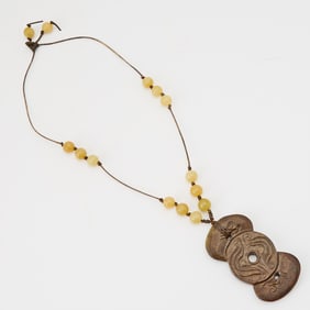 A Chinese Mottled Jade Carving of a Pendant Ming Dynasty