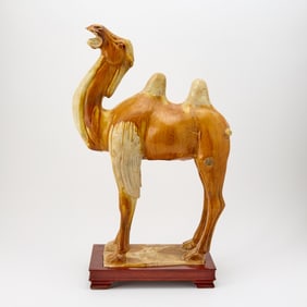 A Chinese Sancai Glazed Pottery Figure of a Bactrian Camel Tang Dynasty