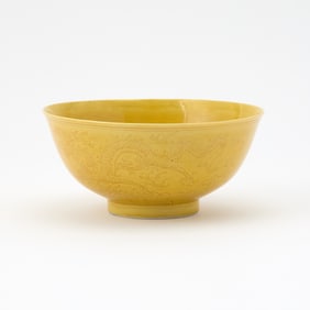 A Chinese Yellow Glazed Incised Porcelain Bowl Six-character Kangxi Mark and of the Period