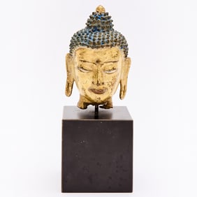 A Sino-Tibetan Parcel Gilt Bronze Head of Buddha 18th century or earlier