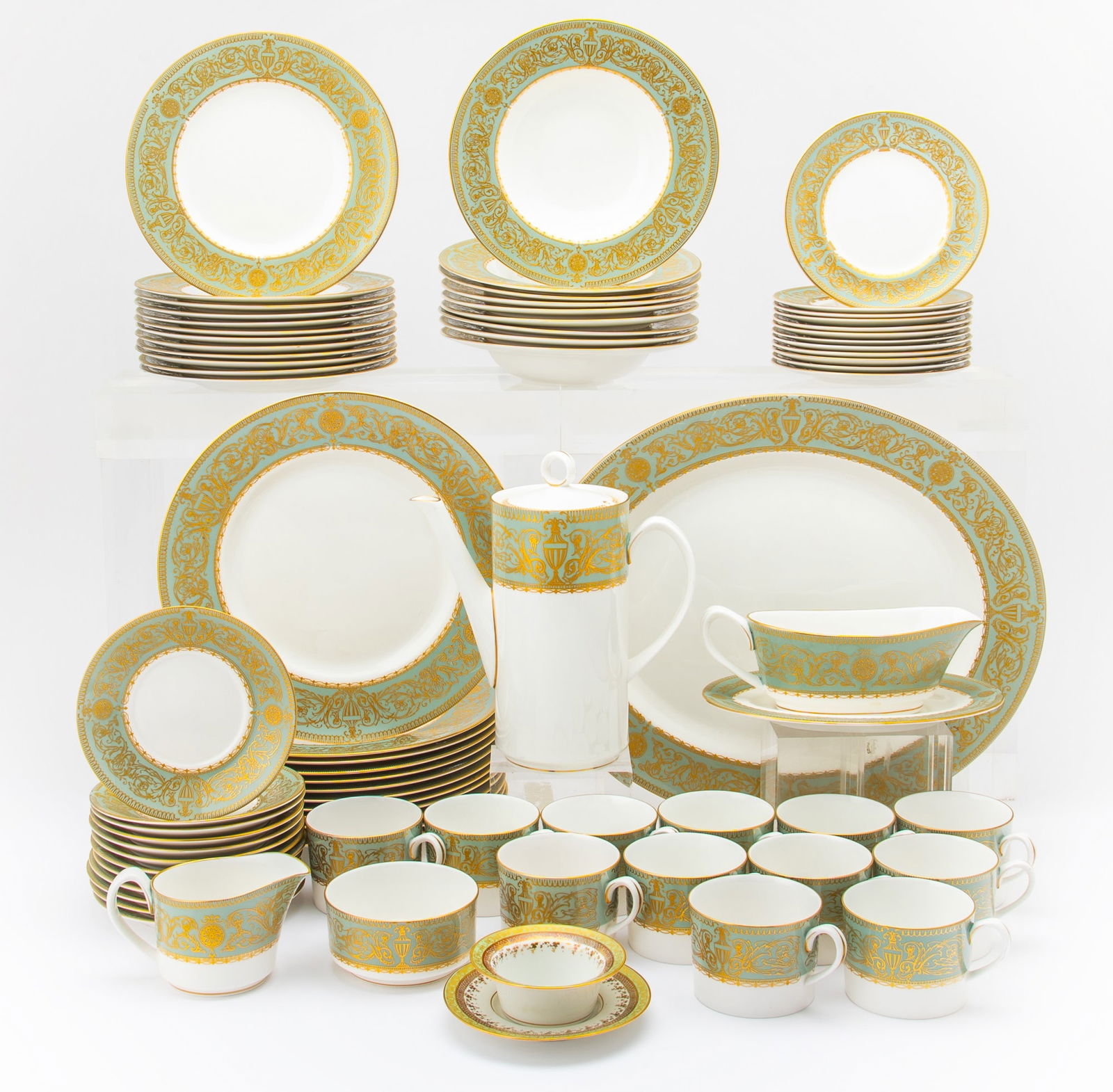 Royal Worcester Porcelain "Hyde Park" Pattern Partial Dinner Service: Comprising: Twelve dinner plates, diameter 10 3/4 inches Twelve salad/dessert plates Nine soup bowls Twelve bread and butter plates Twelve saucers Twelve teacups Coffee pot Sugar bowl