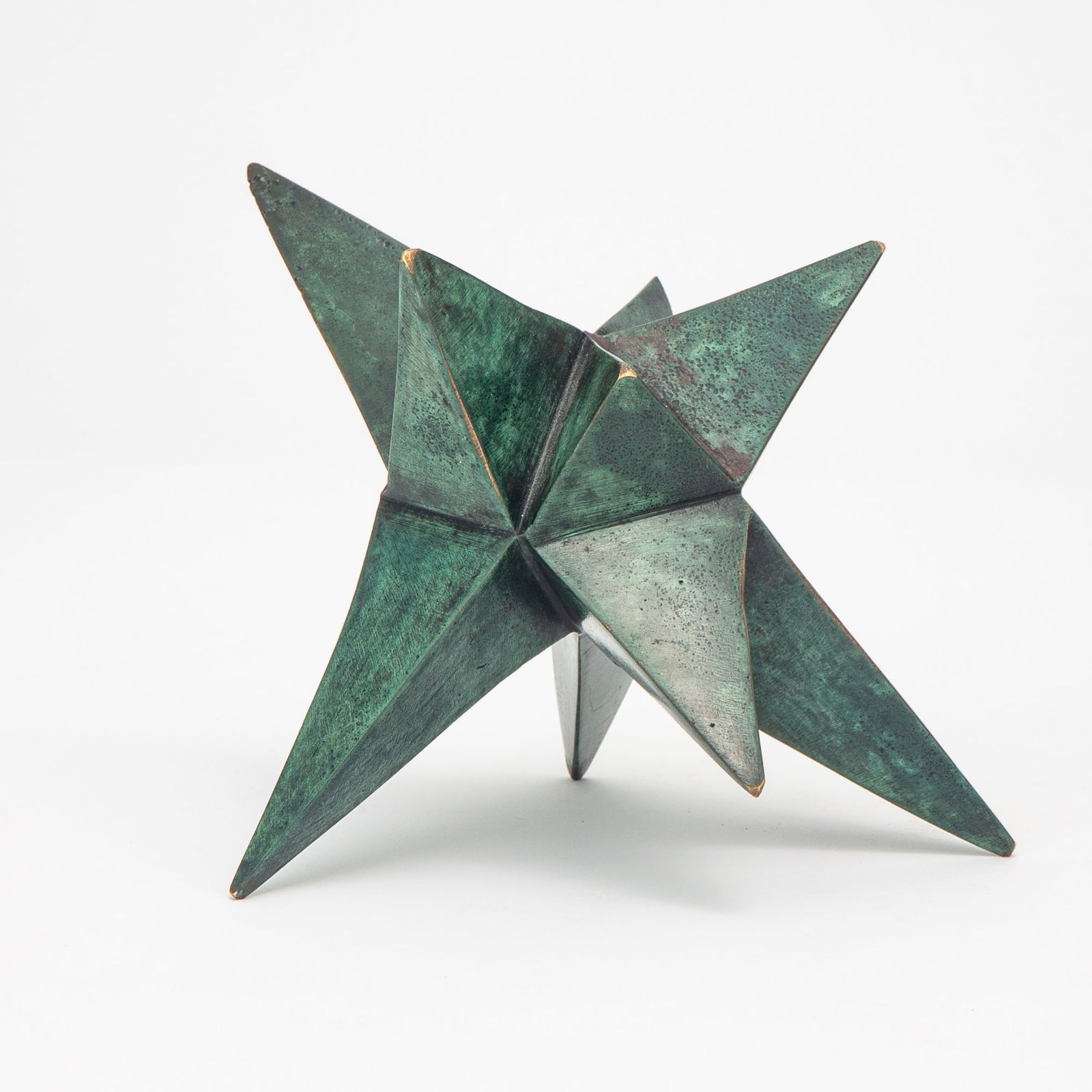 Mathias Goeritz: German/Mexican, 1915-1990Estrella (Star), 1973Initialed MG Bronze with green patina4 3/8 × 6 1/4 × 5 1/2 inches (11.0 × 16.0 × 14.0cm)Provenance:Sale, Christie's Ne