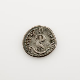 The source of Aldus Manutius' dolphin and anchor printer's device