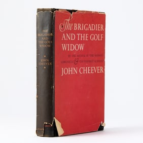 A shelf of first editions, including a signed Cheever and a large group of Philip Roth
