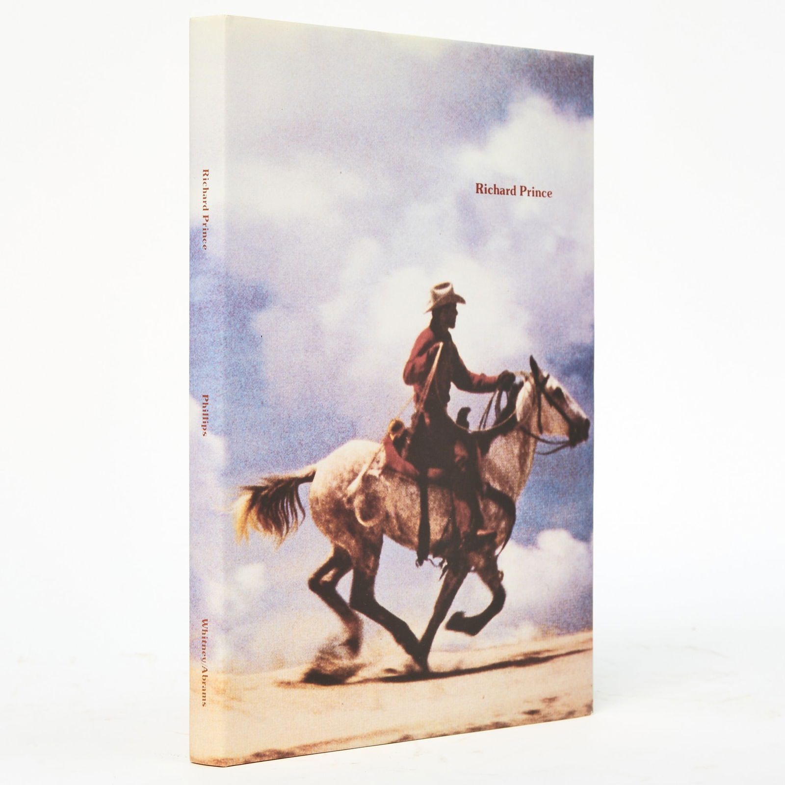 A signed copy of Richard Prince's 1992 Whitney Museum exhibition catalog: PRINCE, RICHARD; Edited by LISA PHILLIPS Richard Prince [The Whitney Museum exhibition catalog]. New York: Harry N. Abrams for the Whitney Museum, 1992. Signed by Richard Prince on the title page. Har