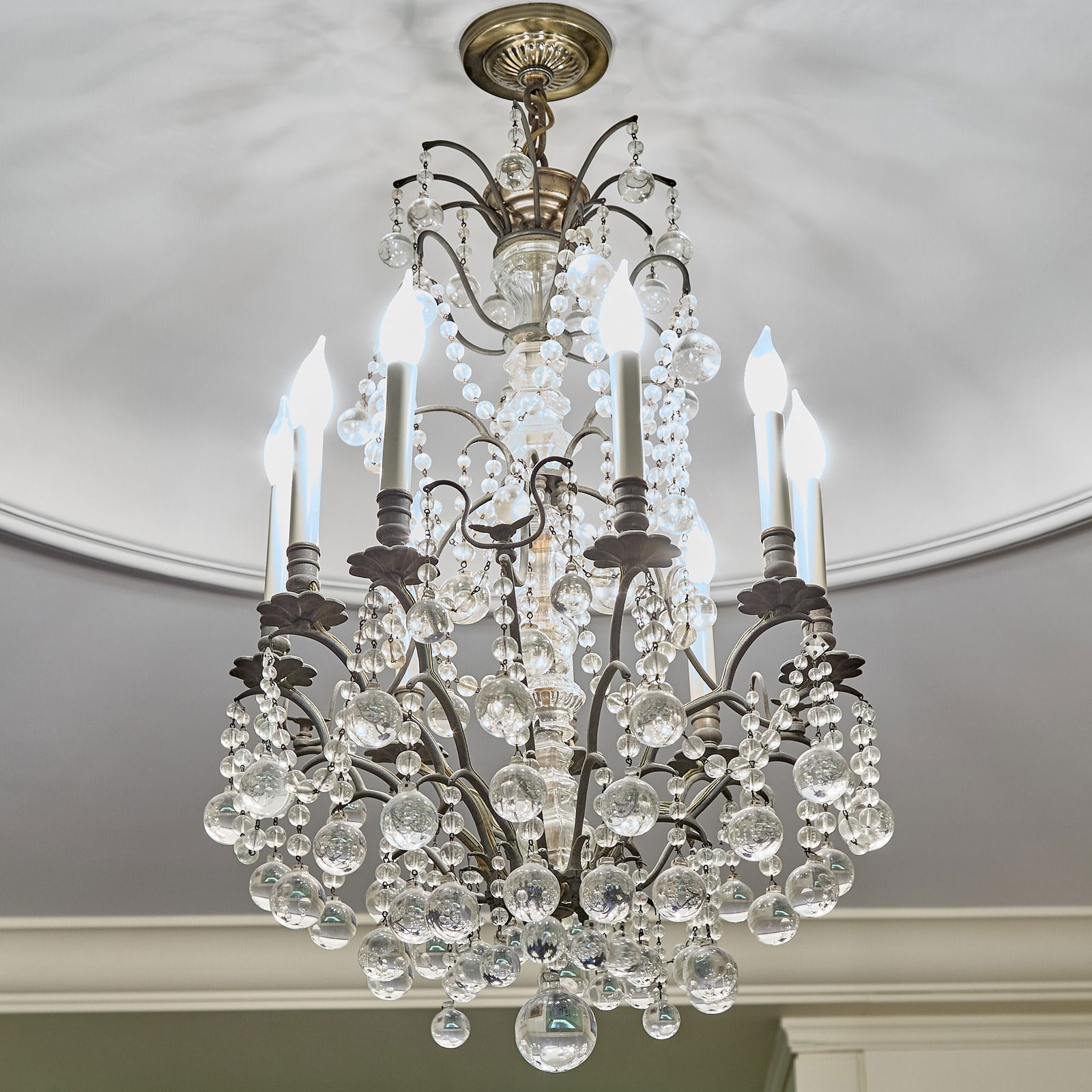 Louis XV Style Glass and Metal Nine Light Chandelier: Height 31 inches, diameter 20 1/2 inches.