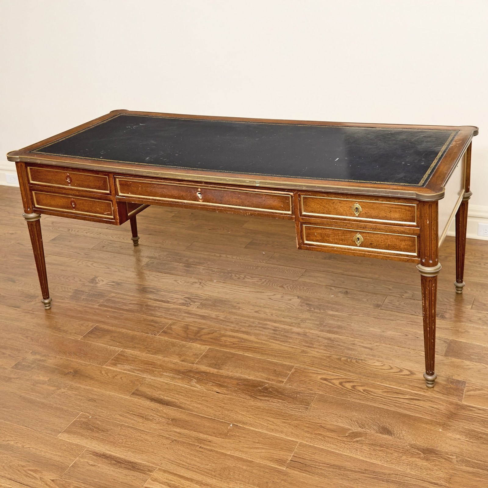 Louis XVI Style Gilt-Metal Mounted Mahogany Bureau Plat: 20th Century Height 30 inches, width 6 feet 1/2 inch, depth 30 1/2 inches. Vicki Downey, Co-Trustee of The Barbara Taylor Bradford Trust and one of Barbara’s closest friends, said: “