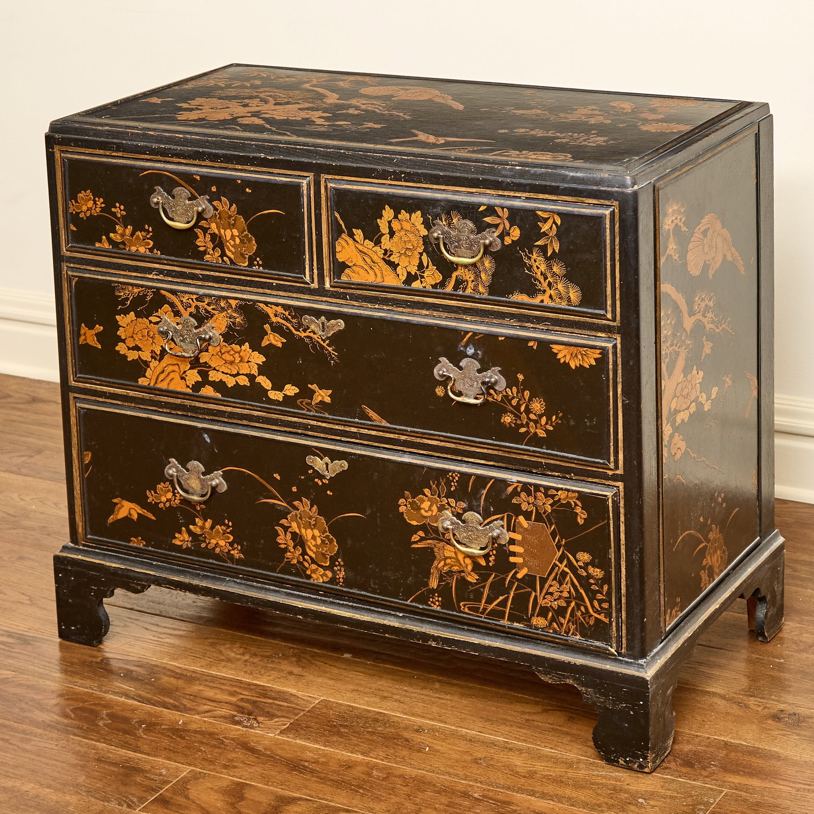 Black Lacquer Chinoiserie Decorated Chest of Drawers: Height 32 inches, width 36 inches, depth 19 1/4 inches. flaking and losses; edgewear