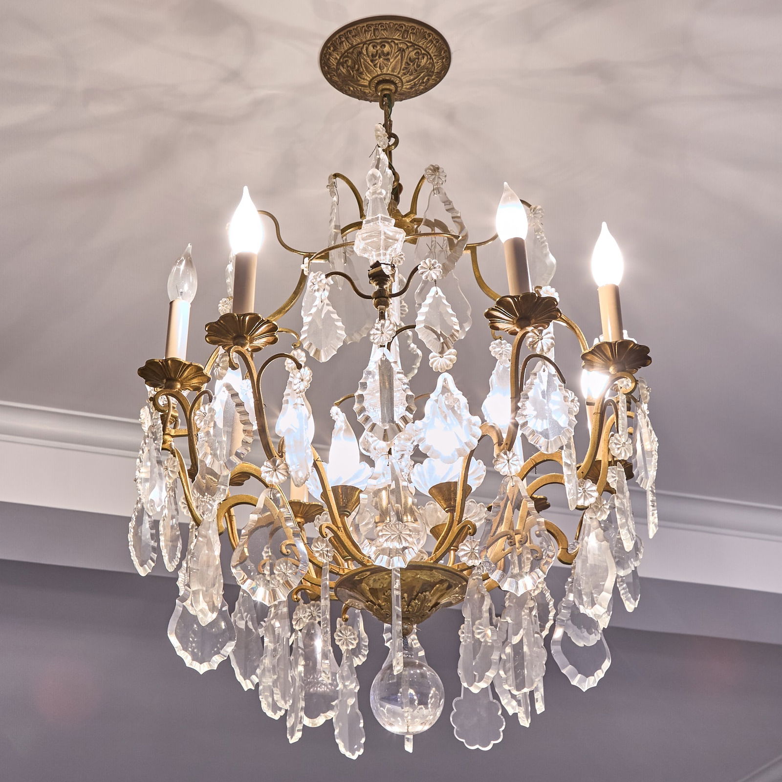 Louis XV Style Gilt-Metal and Glass Eight Light Chandelier: Height 28 inches, width 22 1/2 inches.