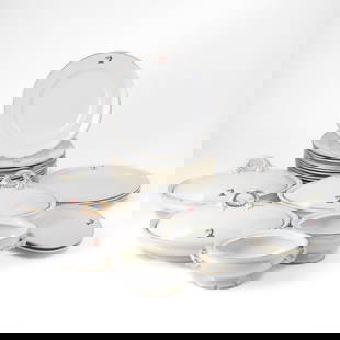 Royal Worcester Porcelain 'Dragon' Pattern Part Table Service: Comprising: Thirteen dinner plates, diameter 10 3/4 inches Three oval tureens with covers, length 12 inches Two small oval two-handled tureens with two under plates, lacking covers, length 8 3/4 inch