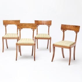 A Set of Four Neoclassical Mahogany Dining Chairs