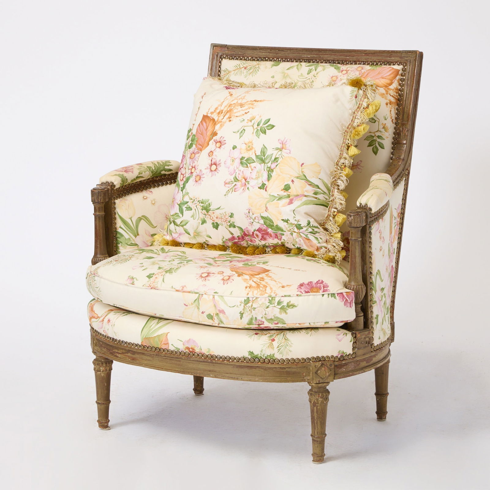 Louis XVI Floral Upholstered Bergère: Late 18th century The padded back, arms and seat within a molded frame with turned and reeded arm supports, on tapering carved legs. Height 35 inches (89 cm), width 30 inches (76 cm), depth 20 inches