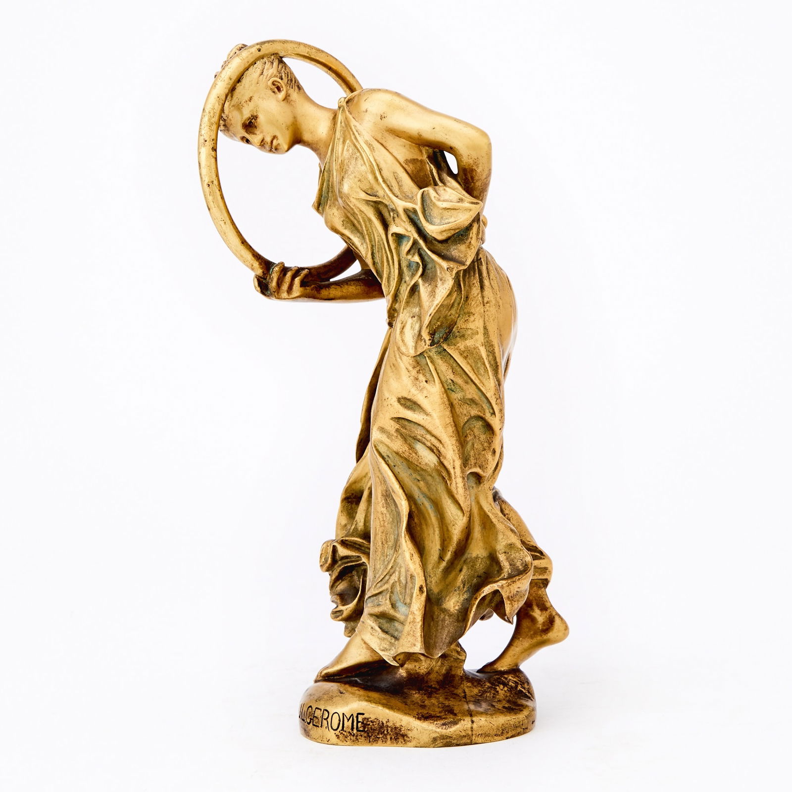 French Gilt-Bronze Figure of a Hoop Dancer: Second quarter 19th century, after a model by Jean-Leon Gerome La Danseuse au CerceauInscribed J.L. GROME on base and stamped Soit Paris / P74.Height 9 inches (22.8