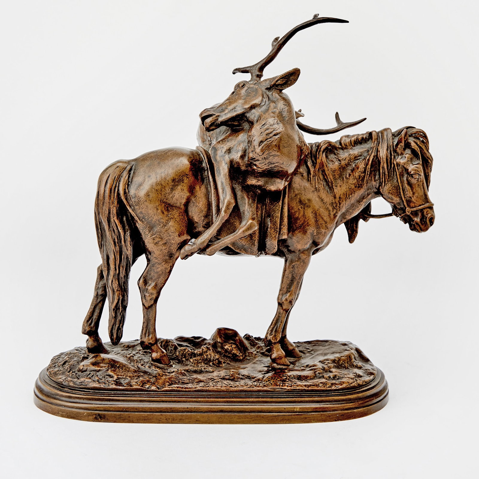 French Patinated Bronze Animalier Figural Group of a Highland Pony and Stag: Late 19th/ early 20th century, after a model by Isidore Jules Bonheur Depicting a pony standing foursquare with the body of a stag on it's back, on an oval base, inscribed I. BONHEUR on base and P.A. 