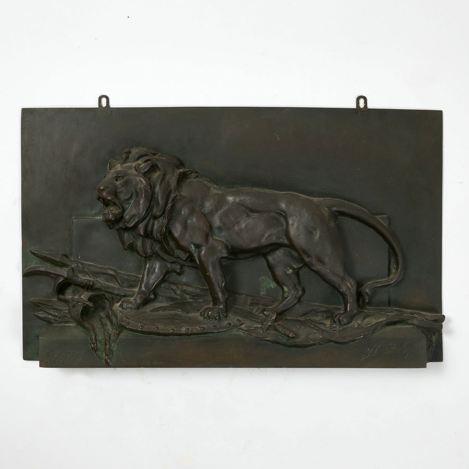 Hippolyte Marius Galy (1847-1929): 1900 Bronze relief Roaring lion overcoming enemy weapons, armor and standards, inscribed Exposition Universelle Palais de Armées de Terre et de Mer. Height 13 inches (33 cm), width 21 1/2 inches