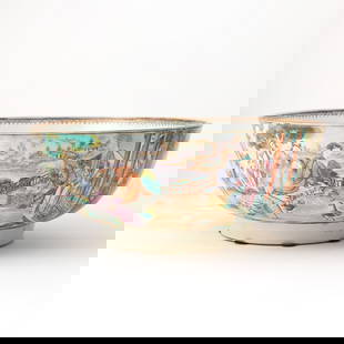 A Chinese Export Porcelain Punchbowl: 18th century, QIng Dynasty Decorated in the famille rose palette and with partial gilding to show scenes of aristocratic Chinese figures amusing themselves observing animals between shaped reserves de