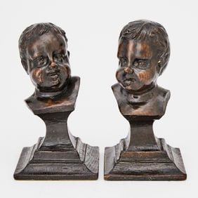 A Pair of Continental Carved Oak Busts of Cherub Heads