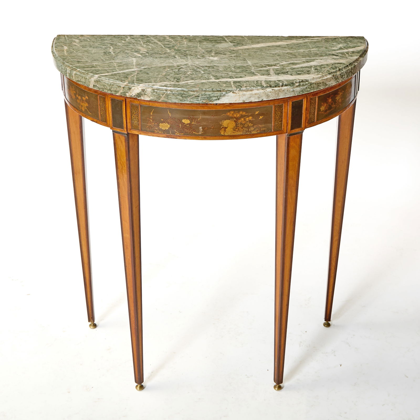 Dutch Neoclassic Satinwood Console: Circa 1800, in the manner of Matthijs Horrix The later demilune white veined green marble top above a conforming base, the frieze with japanned