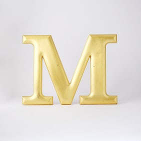The iconic screen-used wall-mounted "M" from The Mary Tyler Moore Show