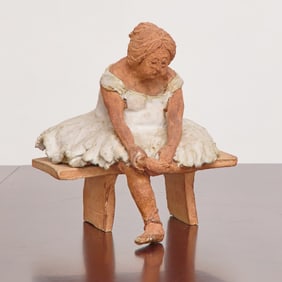 Painted Ceramic Figure of a Ballerina Sitting on a Bench