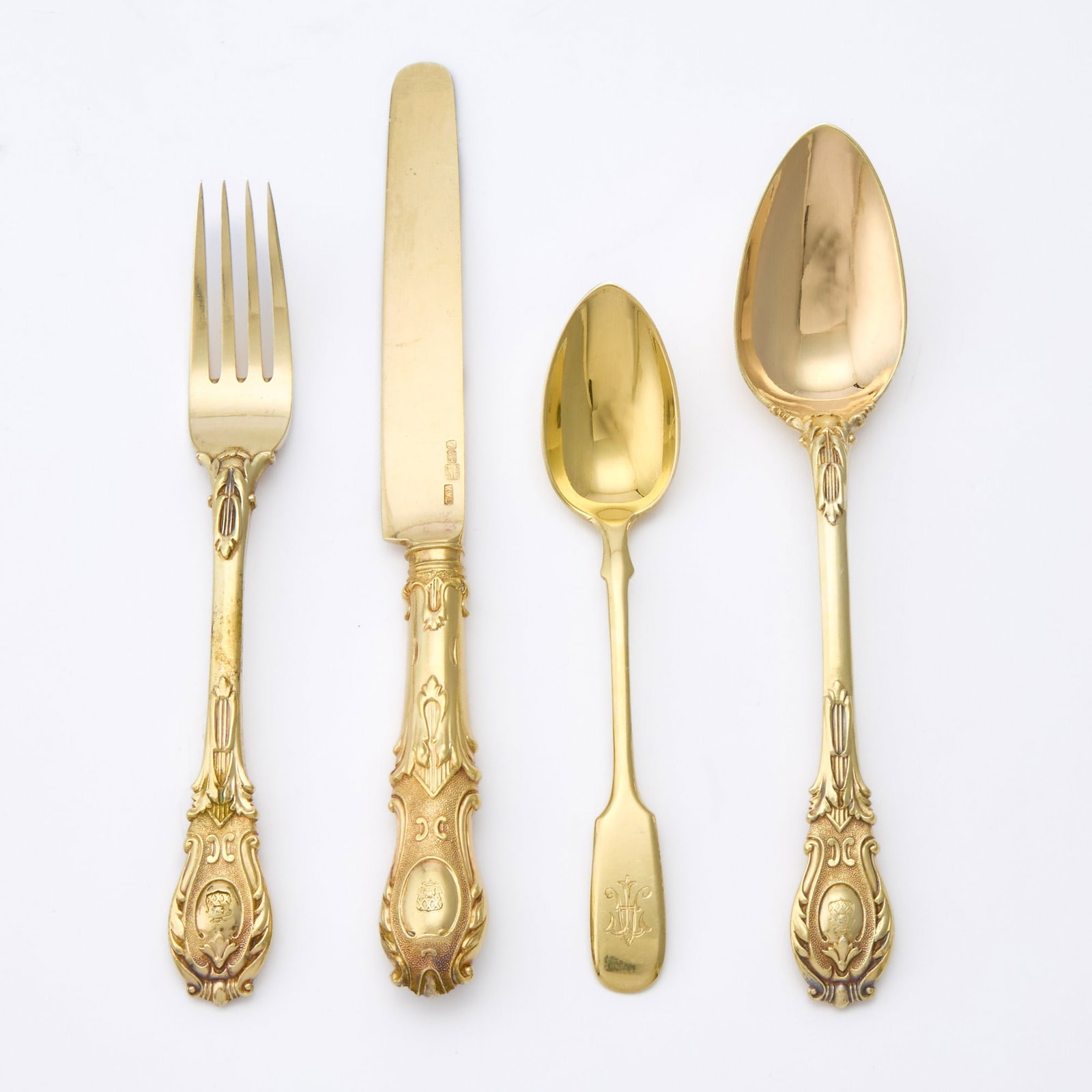 Russian Silver-Gilt Flatware Service: Henrik August Läng, St. Petersburg, 1841 Comprising six forks, six knives, six spoons, each engraved with a coat of arms; together with a set of six silver-gilt teaspoons, Grachev Brothers, St. P