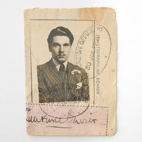 Sir Laurence Olivier's signed visa from 1929, with a striking photograph of the young actor