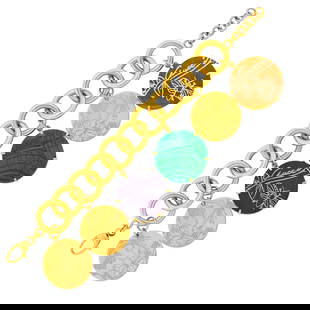 Gucci Gold and Hardstone Charm Bracelet: 18 kt., six circular charms of engraved gold and tiger's eye, malachite and purple hardstone, bracelet and charms signed Gucci, ap. 59.8 dwts. gross. Lengths 8 14 to 7 1//4 inches, adjustable. 