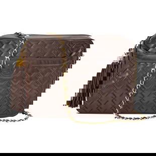 Chanel Dark Brown Quilted Lambskin Leather Camera Bag: Zip top bag with tassel zipper pull, stitched double 'CC' on front slip pocket, gold-tone hardware and woven-in leather chain strap. Matching leather inteior with side zippered pocket and slip pocket,