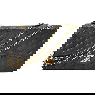 Chanel Black Lambskin Quilted Leather Double Flap Bag: Double flap bag with gold-plated hardware, double 'CC' turn lock closure and woven-in leather chain strap, interior with three compartments, main compartment with two slip pockets, zippered pocket und