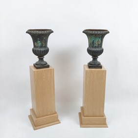 Pair of Black Painted Cast Iron Urns Together with a Pair of Oak Pedestals