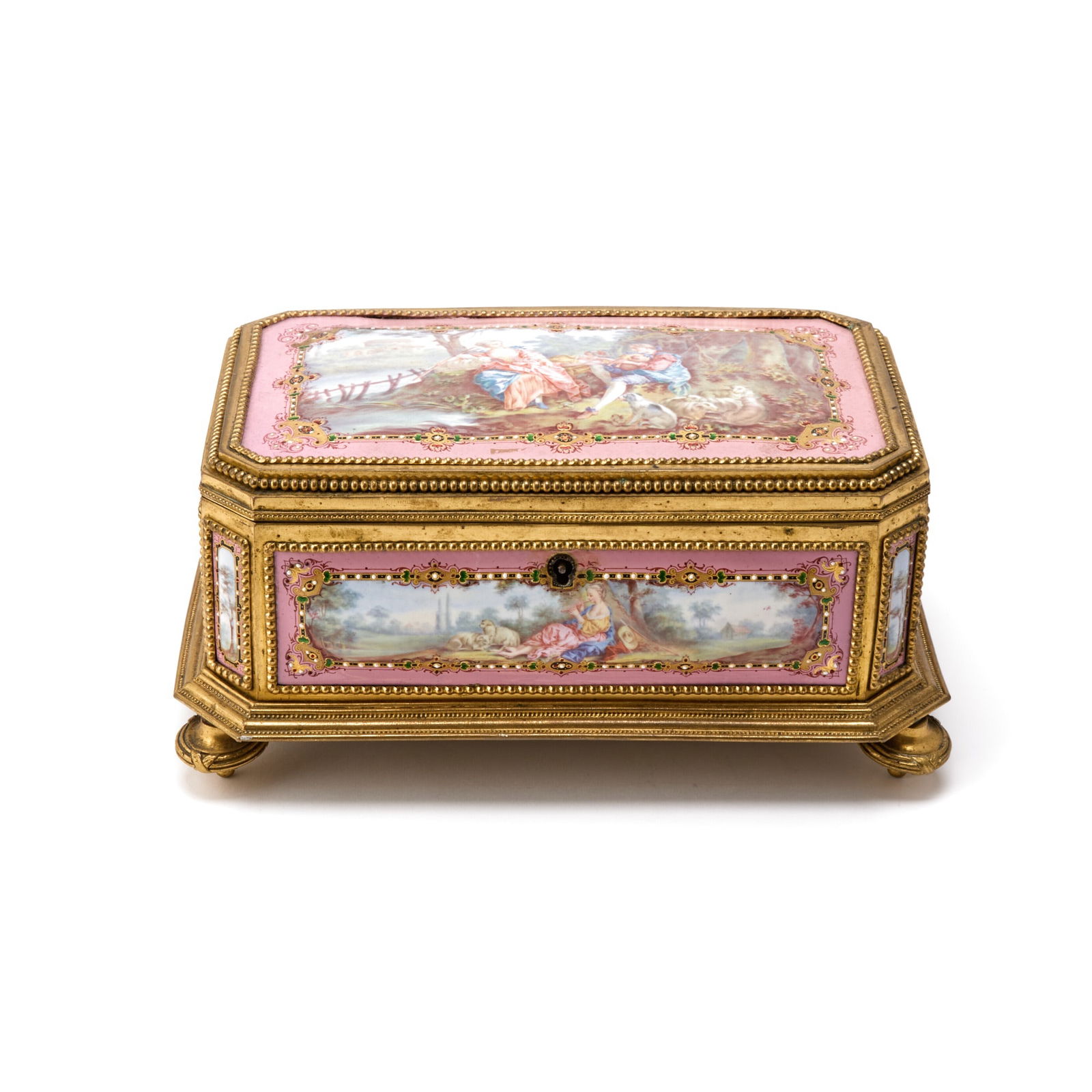 Sevres Style Gilt-Metal Mounted Pink-Ground Porcelain Footed Casket: Decorated with reserves depicting courting scenes. Height 4 3/4 inches, width 10 1/2 inches, depth 6 3/4 inches. Bending to feet, rubbing to gilt metal commensurate with age, in