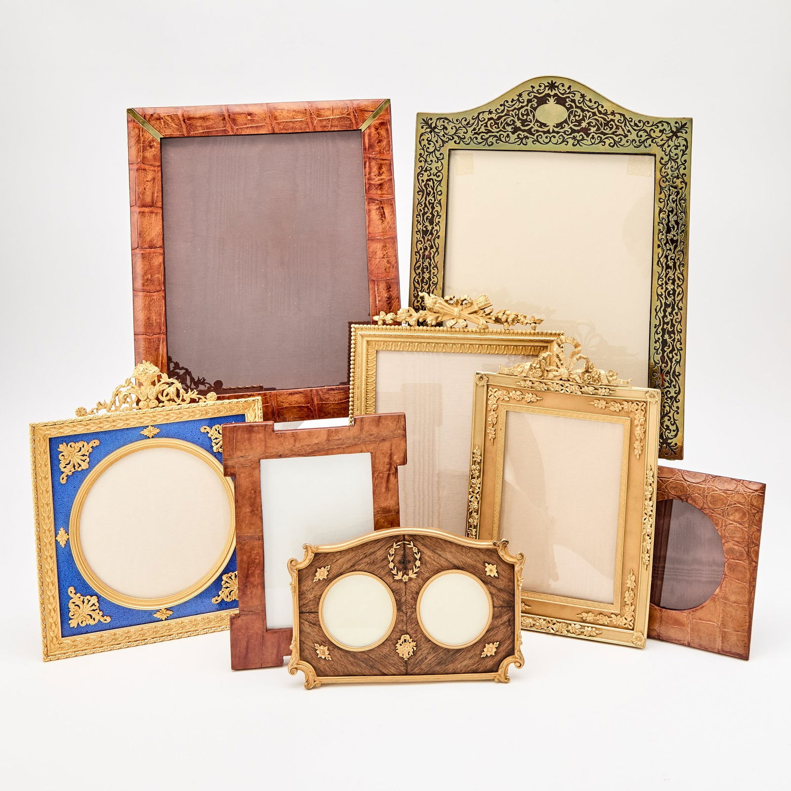 Group of Eight Picture Frames: Including gilt-metal and wood examples. Height of largest 14 inches, width 10 3/4 inches; frame opening 9 7/8 inches x 7 7/8 inches.