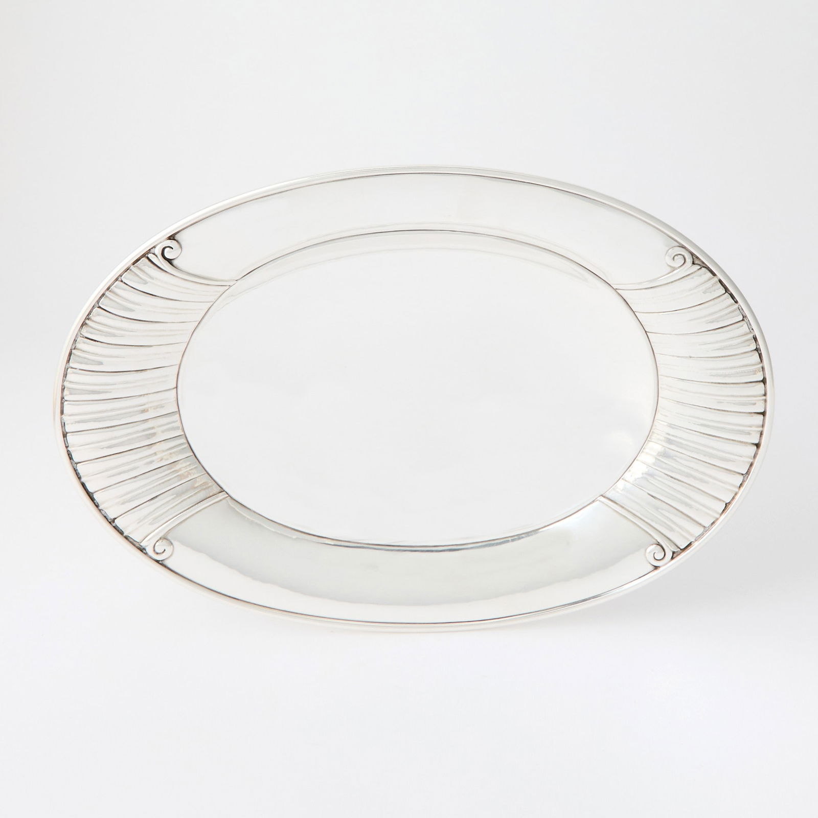 Georg Jensen Sterling Silver Tray: Pattern no. 45, designed by Johan Rohde, post-1945 Of shallow oval form, height 1 1/2 inches, length 11 7/8 inches. Approximately 19 ounces.