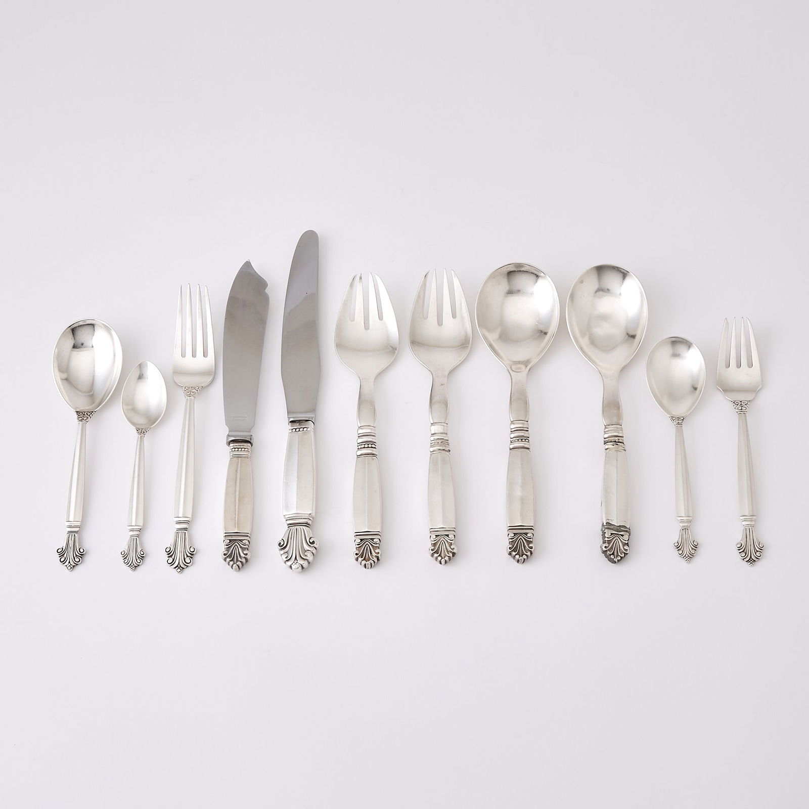 Assembled Georg Jensen Sterling Silver 'Acanthus' Pattern Flatware Service: Designed by Johan Rohde in 1917, most circa 1933-44, others post-1945 Comprising:Twelve dinner forks Twelve salad forksTwelve dessert spoons (le