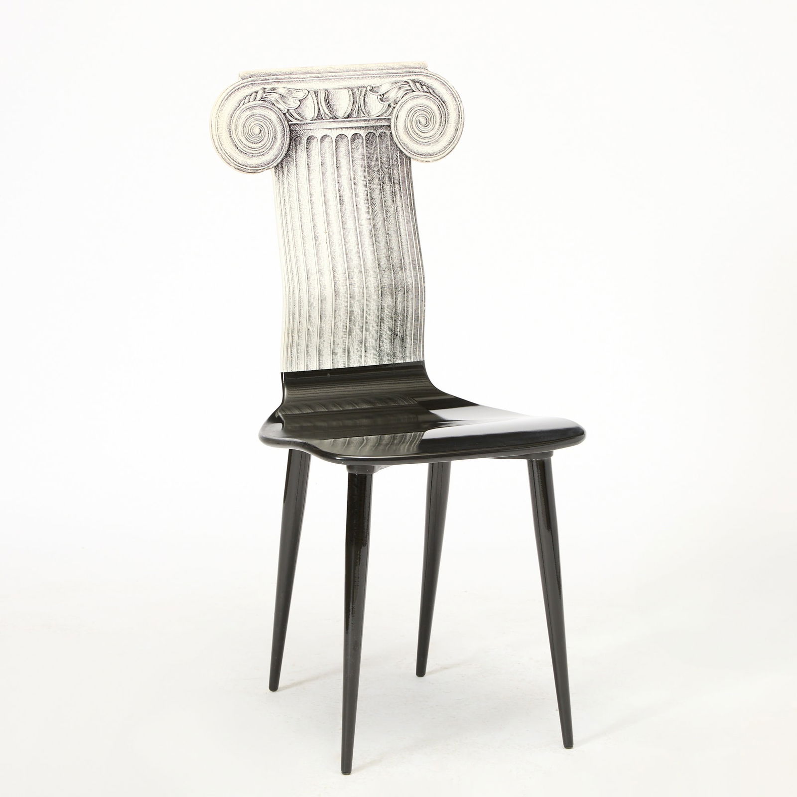 Piero Fornasetti Printed and Painted Wood “Capitello Iconico” Side Chair: Late 20th century Height of back 37 inches, height of seat 19 inches, width 16 1/2 inches, depth 20 1/2 inches.