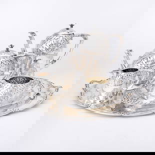 Swedish Arts & Crafts Silver Tea and Coffee Service: Otto Larsson, early 20th century Comprising a teapot, coffee pot, height 8 1/2 inches (21.5 cm), cream jug, sugar bowl, dish and two handled tray, length over handles 17 1/2 inches (44.5 cm), total ap