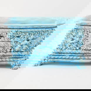 French Blue Faience Renaissance Revival Planter: Late 19th century The molded rectangular well with imagery of cherubs and masks within a foliate surround on paw feet. Height 8 1/2 inches, width 15 1/4 inches, depth 7 1/2 inches. <