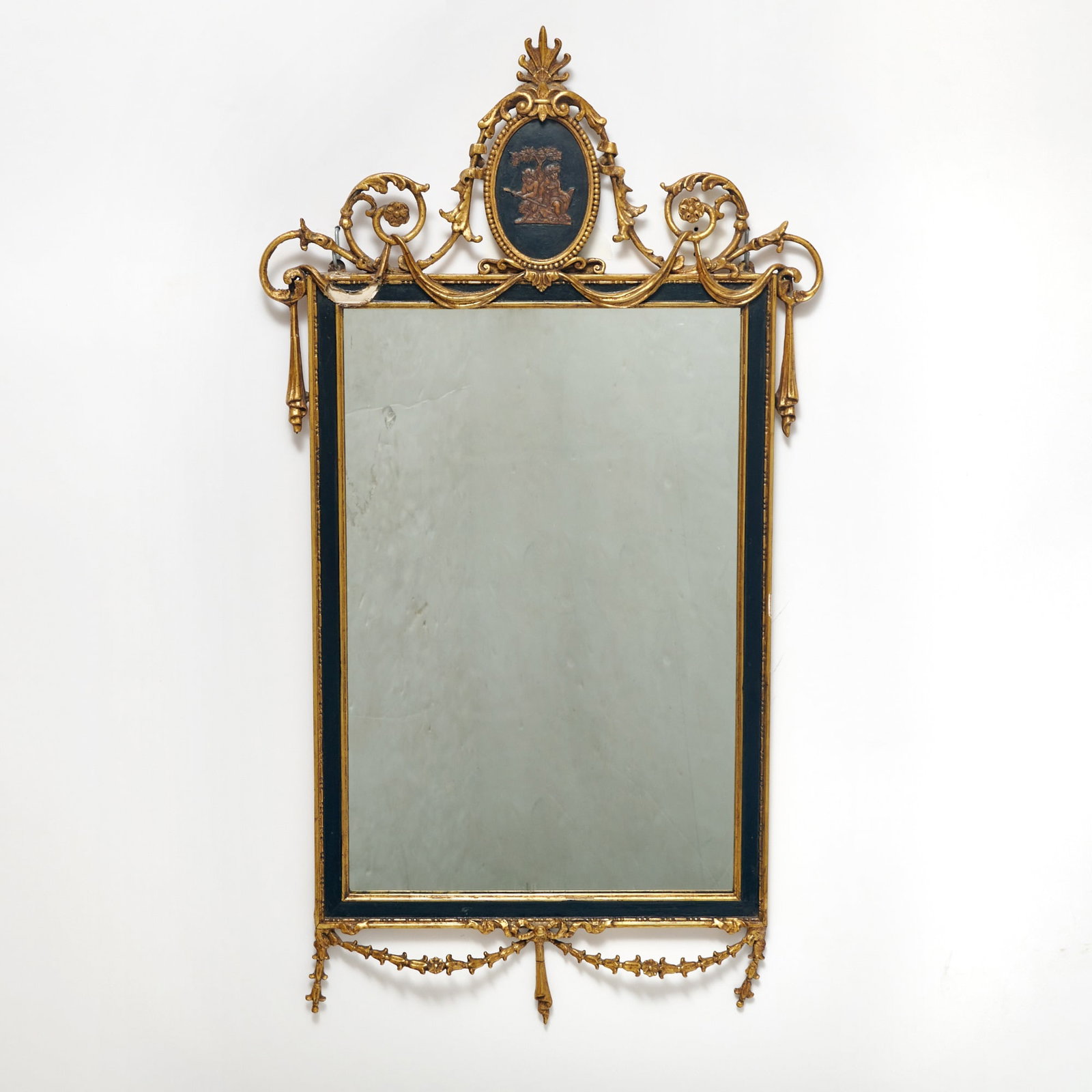 Italian Neoclassical Style Giltwood Mirror: 19th Century Height 40 inches, width 22 inches. One decorative swag was broken prior to delivery by client. Client was alerted of damage and notation made on client receipt.