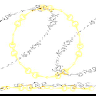 Roberto Coin Gold and Ruby Horsebit Necklace and Bracelet: 18 kt., both with round ruby maker's marks and Italian assay marks, ap. 36.3 dwts. Lengths 17 1/4 and 7 1/4 inches. Width 9/16 inch.